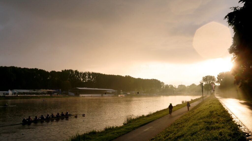 The sun rises over the Bosbaan at the 2014 World Rowing Championships in Amsterdam, Netherlands.